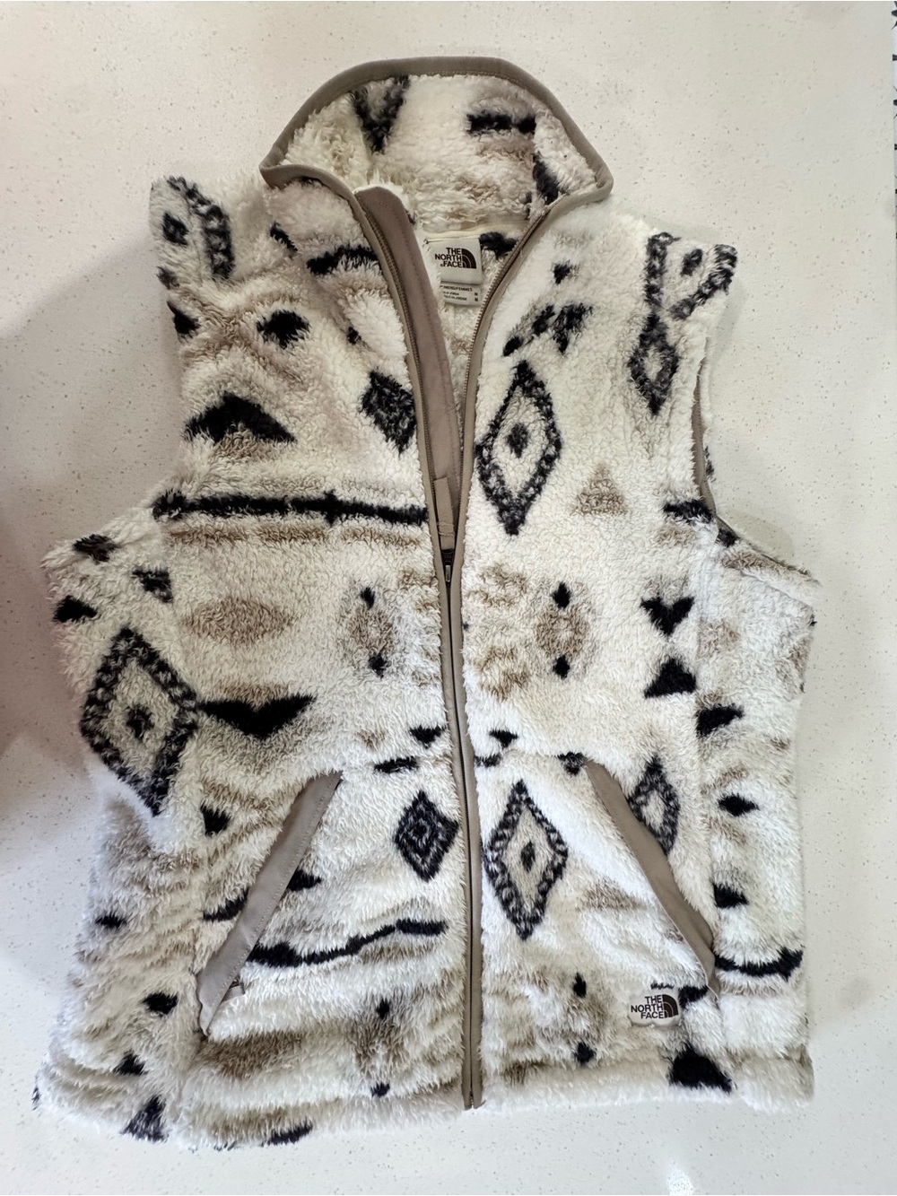 The North Face Cream Sherpa Vest with Black & Tan Pattern